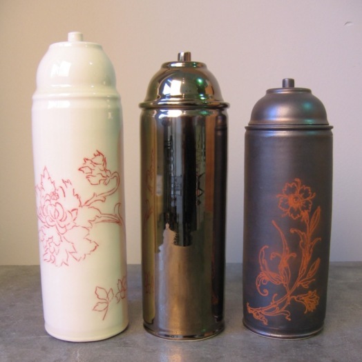 wheel thrown and hand decorated ceramic spray paint cans